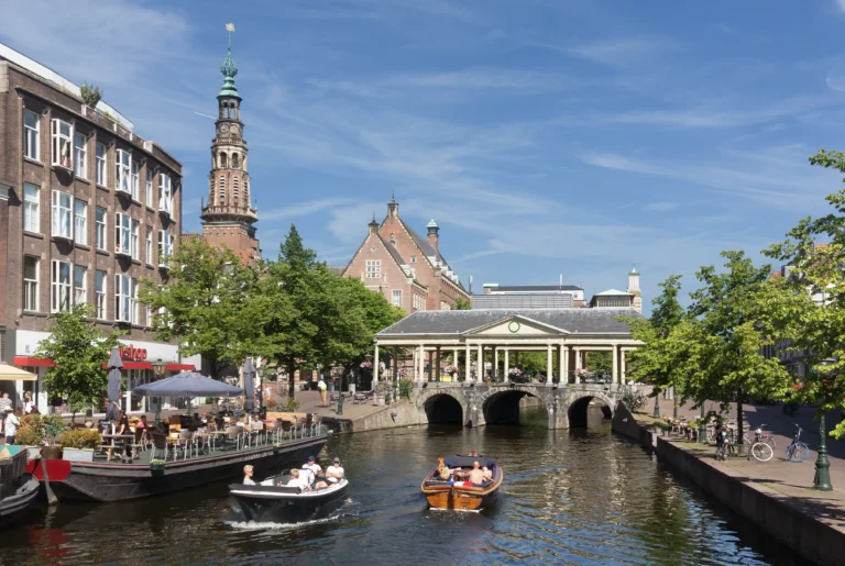 A canal in Leiden showing the city hall and the Koornbrug